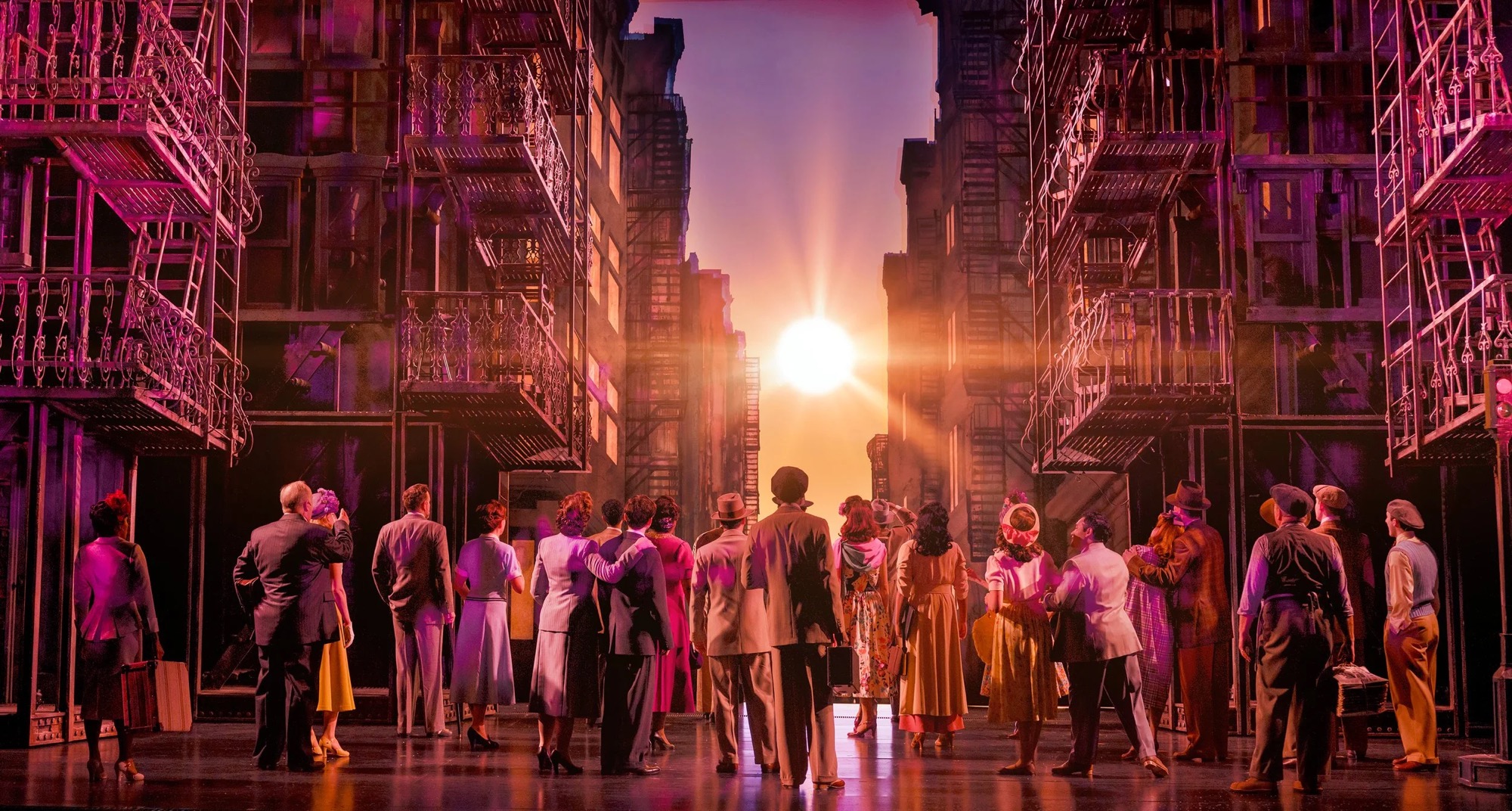 The company of New York, New York on a Manhattan street set