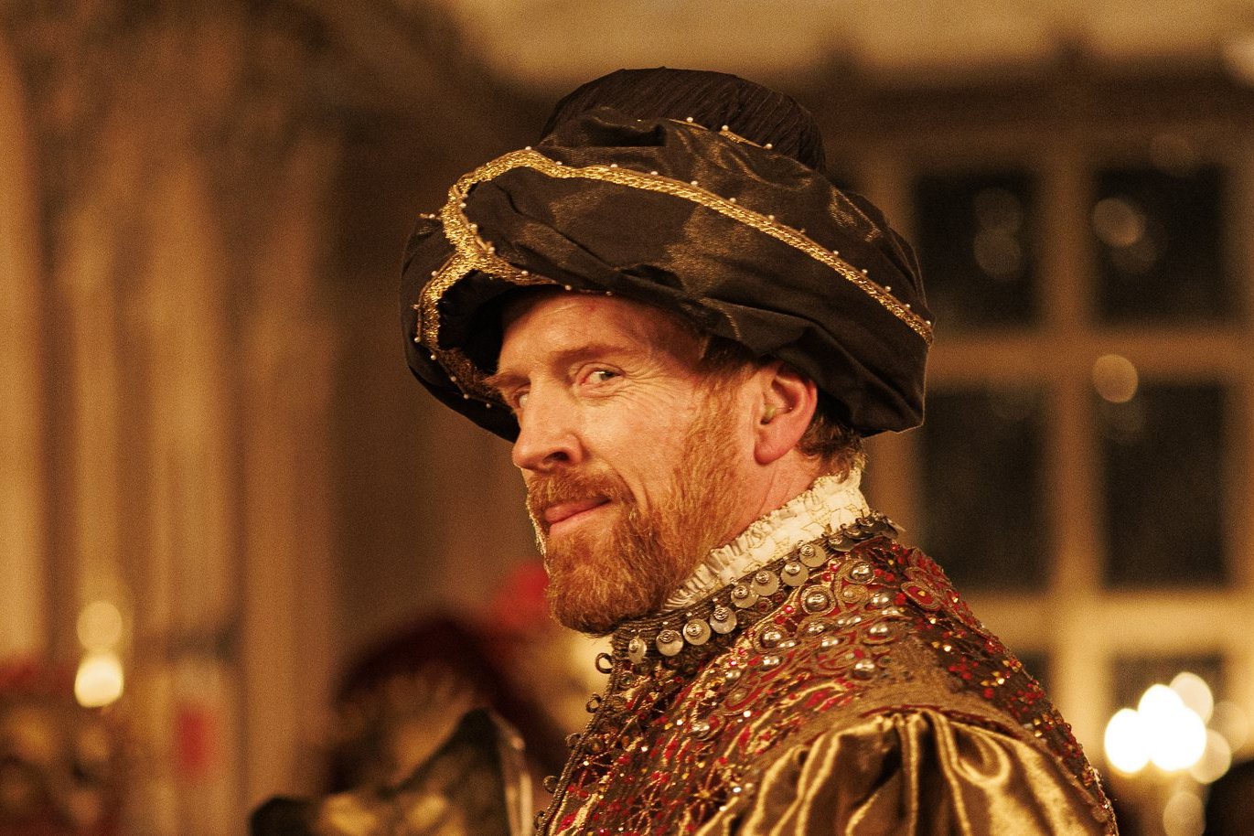 Damian Lewis as Henry VIII at the masque in Wolf Hall: The Mirror and the Light